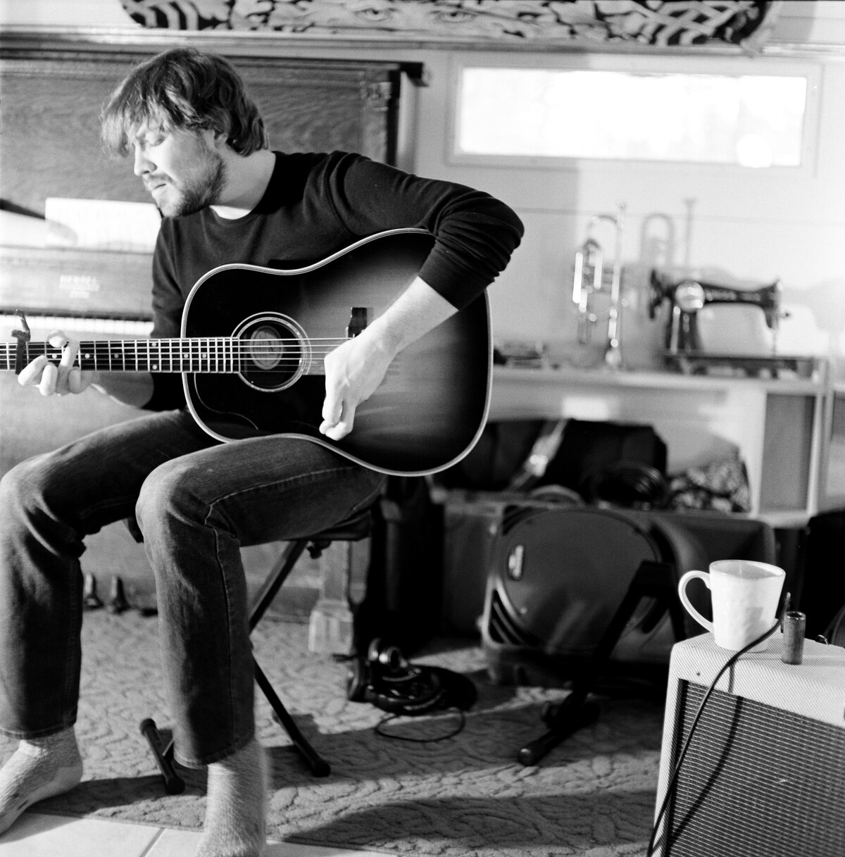 Justin Lantrip wide portrait with guitar